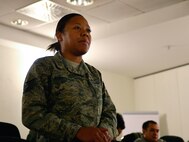 Tech. Sgt. Antoinette Jean-Felix, 86th Medical Group Tricare operations section chief, asks a question during 86th Medical Group Top 3's Senior NCO Symposium, Ramstein Air Base, Germany, Jan. 17, 2017. The symposium gave 86th MDG Senior NCOs and master sergeant selects an opportunity to discuss ways to improve their leadership skills. (U.S. Air Force photo by Airman 1st Class Joshua Magbanua)