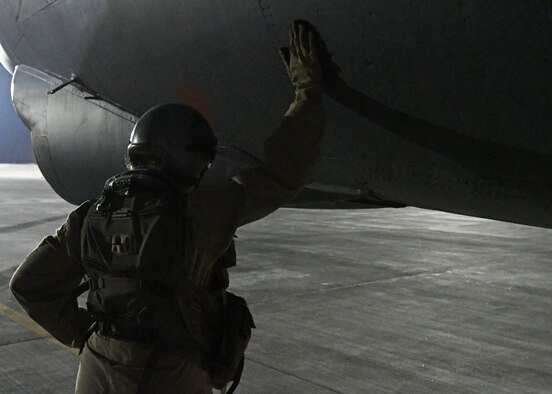 An aircrew member prepares to board a B-52 Stratofortress at an undisclosed location in Southwest Asia, Jan. 4, 2017. The flight was the 201st sortie for the 96th Expeditionary Bomb Squadron and 96th Expeditionary Aircraft Maintenance Unit, marking a new B-52 sortie streak record in support of Operation Inherent Resolve. (U.S. Air Force photo by Senior Airman Miles Wilson)