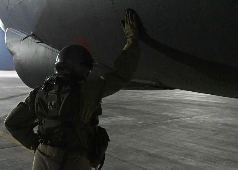 An aircrew member prepares to board a B-52 Stratofortress at an undisclosed location in Southwest Asia, Jan. 4, 2017. The flight was the 201st sortie for the 96th Expeditionary Bomb Squadron and 96th Expeditionary Aircraft Maintenance Unit, marking a new B-52 sortie streak record in support of Operation Inherent Resolve. (U.S. Air Force photo by Senior Airman Miles Wilson)