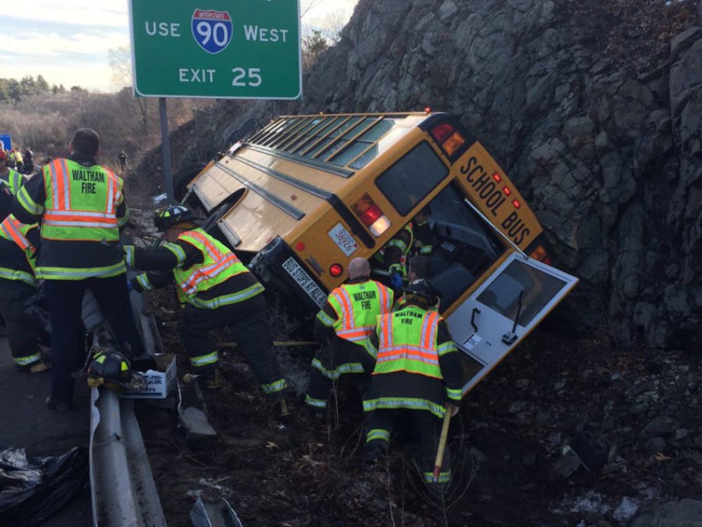 Massachusetts National Guard Capt. David Wilson has been cited by a state trooper for his assistance evacuating this school bus after it crashed last week on Interstate 95.