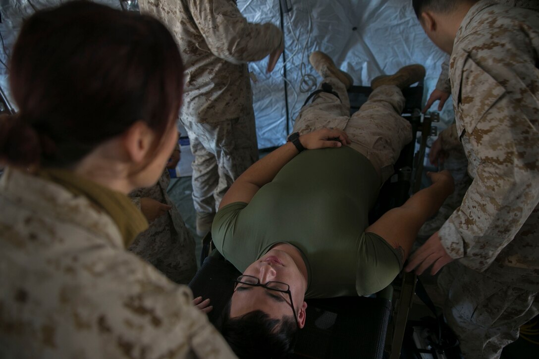 Sailors with Shock Trauma Platoon Detachment, Combat Logistics Battalion 7, Special Purpose Marine Air-Ground Task Force-Crisis Response-Central Command, rehearse their emergency medicine capabilities while forward deployed to the Middle East, Jan. 7, 2017. The ability to set up an emergency medical facility anywhere on the battlefield to quickly and efficiently treat wounded personnel supports the SPMAGTF’s crisis response capability.