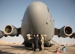 Two Airmen from the 5th Expeditionary Air Mobility Squadron, grease points on the nose landing gear of a C-17 Globemaster III during a post-flight inspection at an undisclosed location in Southwest Asia Jan. 13, 2017. The squadron flies an average of 2,500 sorties a year, moving 180,000 personnel and 80,000 tons of cargo. (U.S. Air Force photo/Senior Airman Andrew Park)