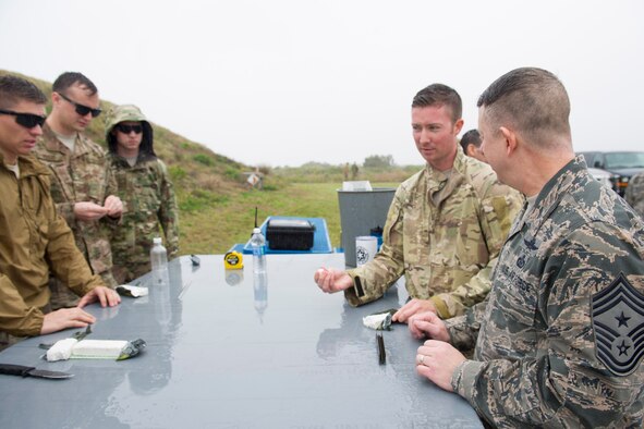 Tech. Sgt. Angel Santiago-Zapata briefs Chief Master Sgt. Brendan Criswell, Air Force Space Command command chief, Jan. 13, 2017, at Space Launch Complex-37 located on Cape Canaveral Air Force Station, Fla. Space Launch Complex-37 encapsulates Delta rockets while they are fitted with their designated payloads before they launch from Cape Canaveral Air Force Station. (U.S. Air Force photo by Matthew Jurgens) 