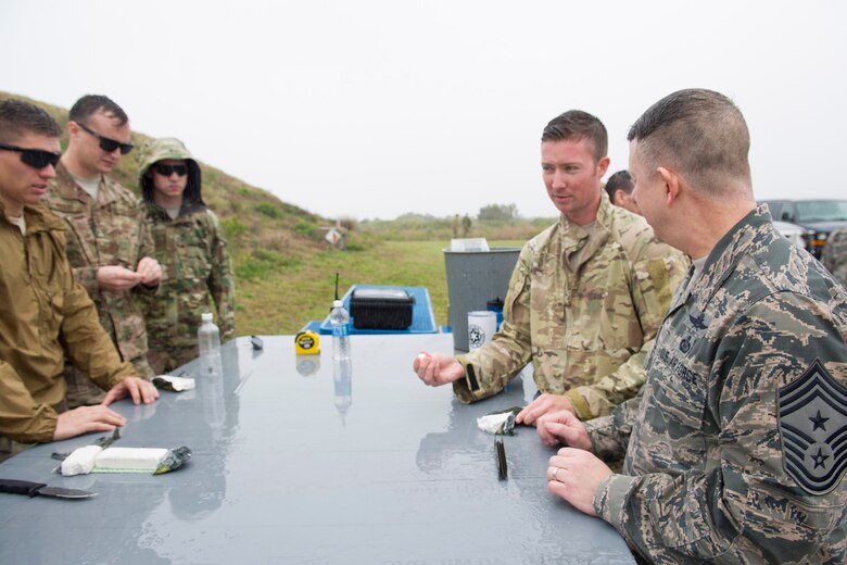 Tech. Sgt. Angel Santiago-Zapata briefs Chief Master Sgt. Brendan Criswell, Air Force Space Command command chief, Jan. 13, 2017, at Space Launch Complex-37 located on Cape Canaveral Air Force Station, Fla. Space Launch Complex-37 encapsulates Delta rockets while they are fitted with their designated payloads before they launch from Cape Canaveral Air Force Station. (U.S. Air Force photo by Matthew Jurgens) 