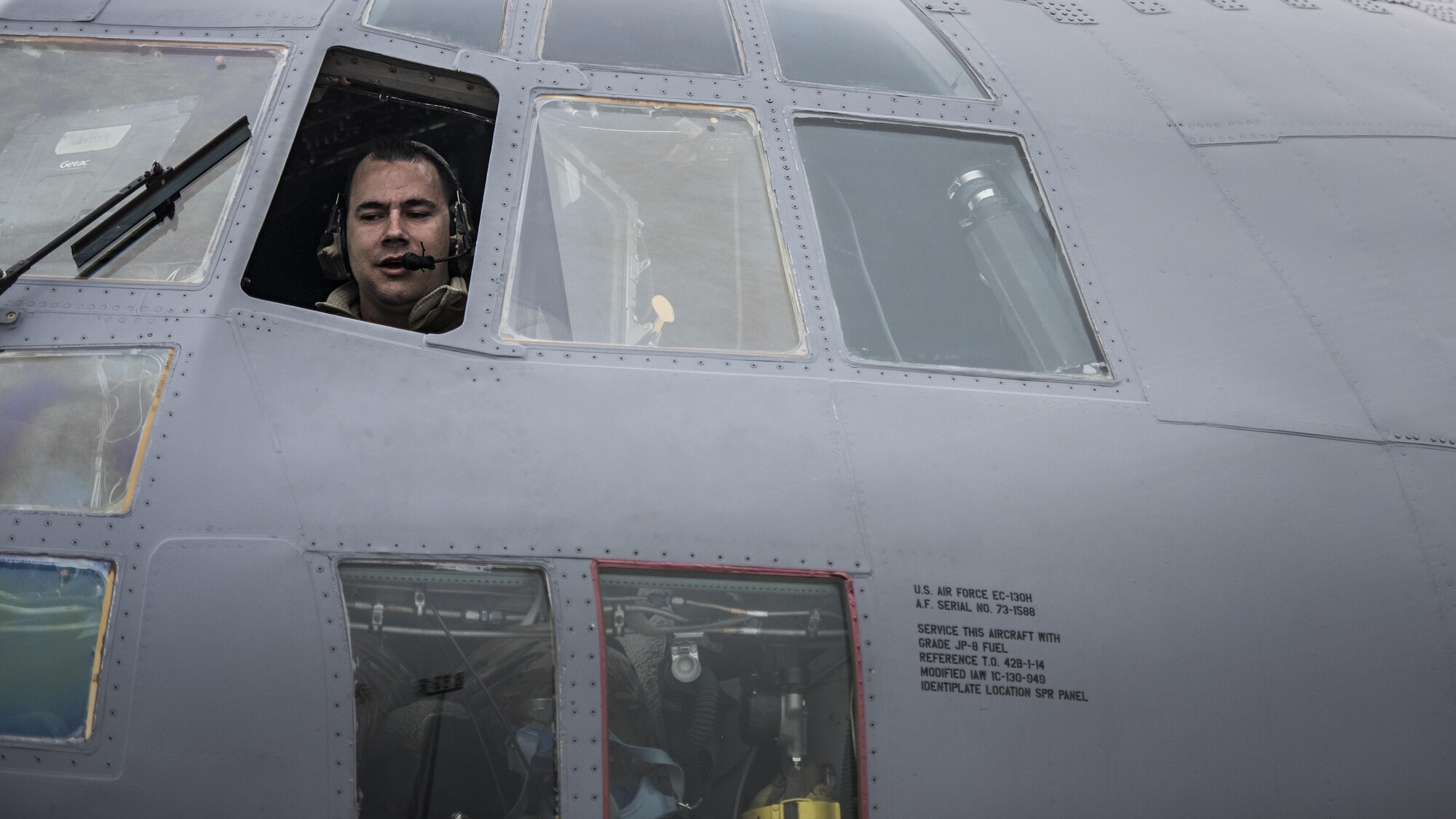 Tech. Sgt. Tony Rivera, 455th Expeditionary Aircraft Maintenance Squadron crew chief, sits in the cockpit of an EC-130 Compass Call Jan. 18, 2017 at Bagram Airfield, Afghanistan. The members of the 455th EAMXS’s EC-130 aircraft maintenance unit currently deployed to Bagram Airfield, Afghanistan have 146 deployments among them. (U.S. Air Force photo by Staff Sgt. Katherine Spessa)