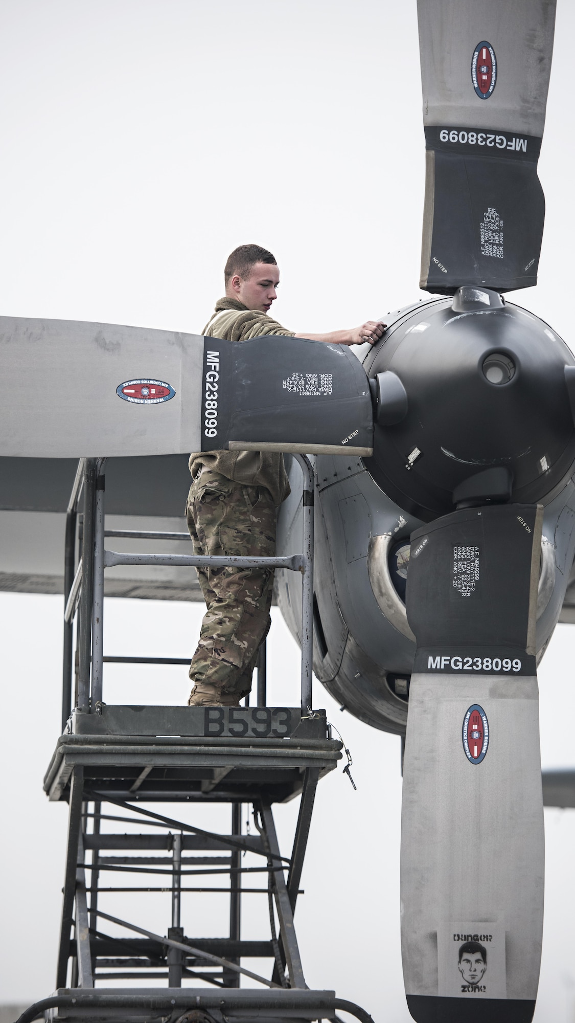 Senior Airman Kyle McClung, 455th Expeditionary Aircraft Maintenance Squadron crew chief, performs an engine inspection on an EC-130 Compass Call Jan. 18, 2017 at Bagram Airfield, Afghanistan. The unit’s mission capable rate, the maintenance term for number of functioning aircraft, has been at a record-breaking high over the last 27 months. (U.S. Air Force photo by Staff Sgt. Katherine Spessa)