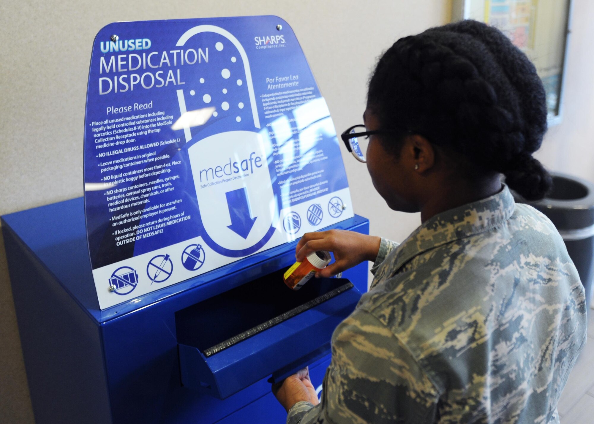 U.S. Air Force Airman 1st Class Darrielle Chark, 19th Medical Group pharmacy technician, properly disposes of personal medication in the medication disposal box Jan. 12, 2017, at the 19th MDG pharmacy on Little Rock Air Force Base, Ark. The disposal box is available 7:30 a.m. to 4:30 p.m. Monday through Friday in the pharmacy lobby. (U.S. Air Force photo by Airman 1st Class Grace Nichols)