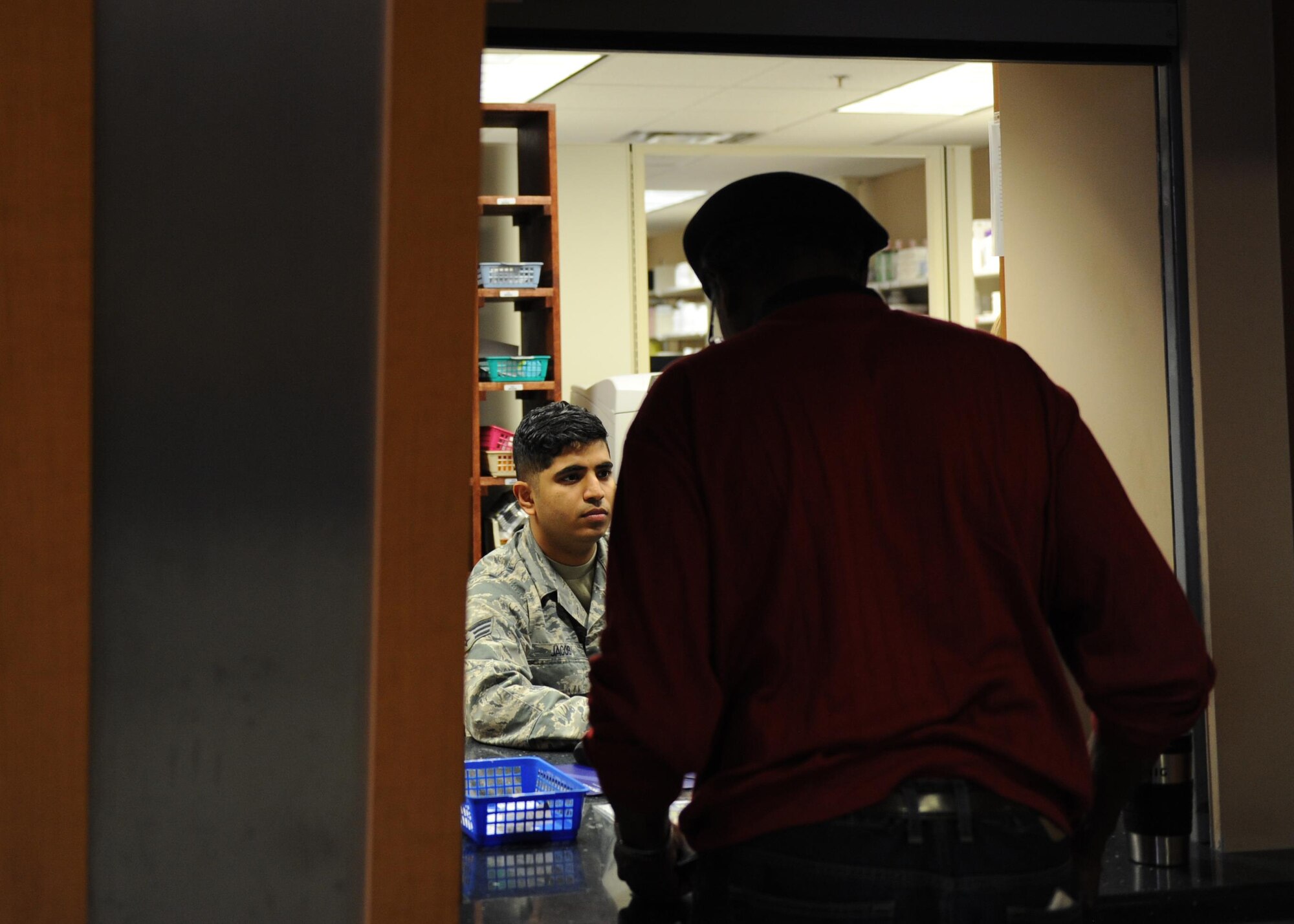 U.S. Air Force Senior Airman Sudeep Jacob, 19th Medical Group pharmacy technician, caters to a customer’s needs Jan. 12, 2017, at the 19th MDG pharmacy on Little Rock Air Force Base, Ark. The pharmacy assists more than 500 patients daily. (U.S. Air Force photo by Airman 1st Class Grace Nichols)