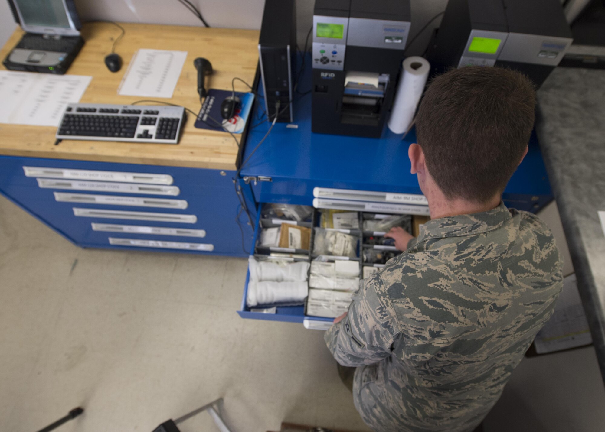 Airman Phillip Tashash, a 49th Maintenance Squadron munitions specialist, searches through asset drawers that are inventoried by the Ammo flight’s new Automated Supply Accountability Program, Jan. 9, 2017, at Holloman Air Force Base, N.M. The ASAP is a new program that Holloman’s Ammo flight uses to track quantity and prices of assets. Tashash created the program, which allows personnel to perform accurate transactions in 10 seconds, rather than five minutes with the old system. (U.S. Air Force photo by Senior Airman Emily Kenney)