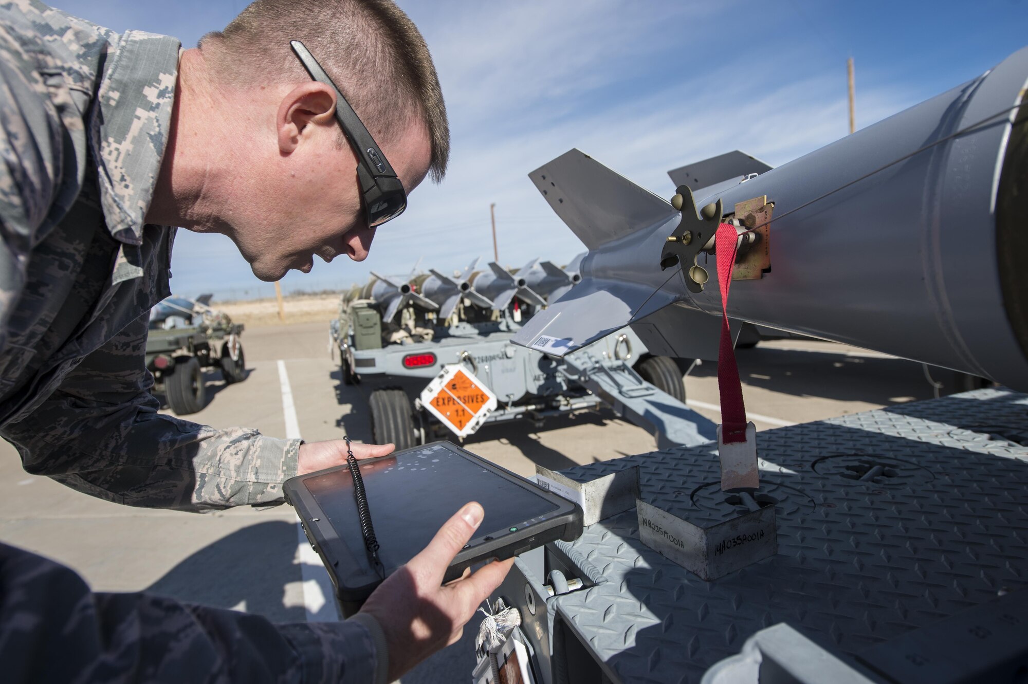 Staff Sgt. Joshua Tobin, a 49th Maintenance Squadron Munitions storage crew chief, uses a Getac tablet to scan a barcode on an asset, Jan. 9, 2017 at Holloman Air Force Base, N.M. The tablets are in the implementation phase, and are able to input information in real-time, significantly cutting down job times. (U.S. Air Force photo by Senior Airman Emily Kenney)