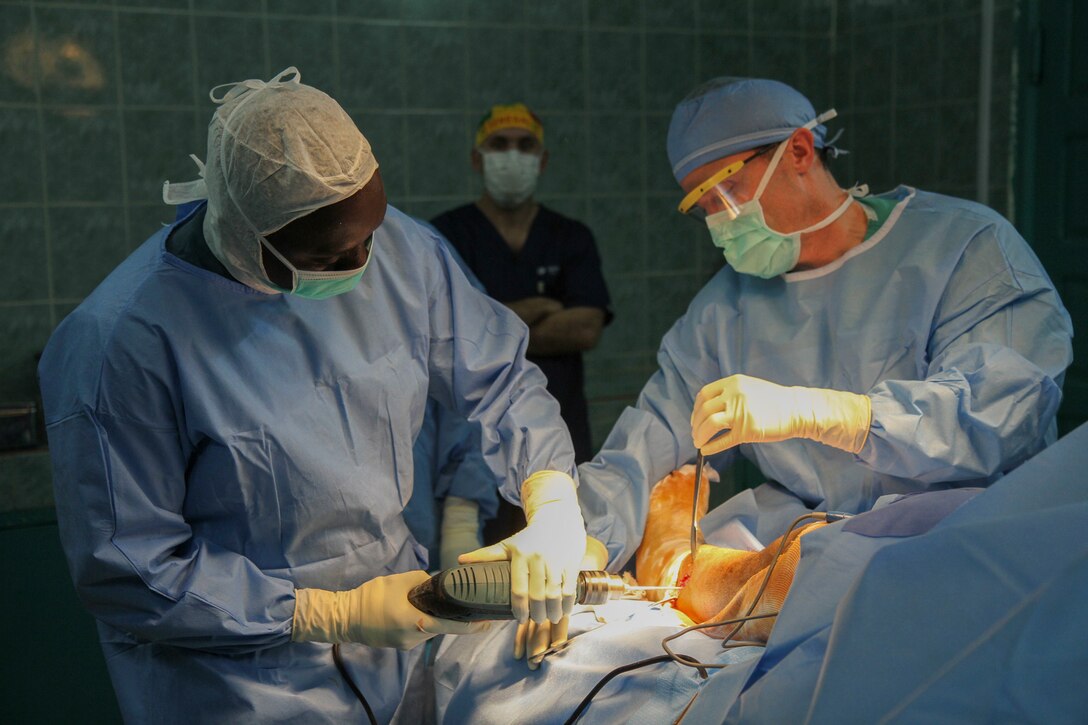Senegalese surgeon Boubacar Mbaye and Vermont Air National Guard surgeon Maj. Anthony Donaldson conduct a leg realignment surgery during Medical Readiness Training Exercise 17-1 at Hospital Militaire De Ouakam in Dakar, Senegal, Jan. 17, 2017. MEDRETE is a combined effort between the Senegalese government, U.S. Army Africa, the U.S. Army Reserve 332nd Medical Brigade in Nashville, Tenn., and the Vermont Air National Guard. MEDRETE 17-1 is the first in a series of medical readiness training exercises that U.S. Army Africa is scheduled to facilitate within various countries in Africa, and serves as an opportunity for the partnered militaries to hone and strengthen their general surgery and trauma skills while reinforcing the partnership between the countries. The mutually beneficial exercise brings together Senegalese military and U.S. Army medical professionals to foster cooperation while conducting medical specific tasks. 