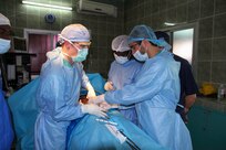 Maj. Anthony Donaldson, a urologist from the Vermont Air National Guard in Burlington, Vermont, Senegalese urologist Dr. Niang, and a Moroccan intern conduct surgery to remove a bladder stone from a patient during Medical Readiness Training Exercise 17-1 at Hospital Militaire De Ouakam in Dakar, Senegal, Jan. 18, 2017. MEDRETE is a combined effort between the Senegalese government, U.S. Army Africa, the U.S. Army Reserve 332nd Medical Brigade in Nashville, Tenn., and the Vermont Air National Guard. MEDRETE 17-1 is the first in a series of medical readiness training exercises that U.S. Army Africa is scheduled to facilitate within various countries in Africa, and serves as an opportunity for the partnered militaries to hone and strengthen their general surgery and trauma skills while reinforcing the partnership between the countries. The mutually beneficial exercise brings together Senegalese military and U.S. Army medical professionals to foster cooperation while conducting medical specific tasks.