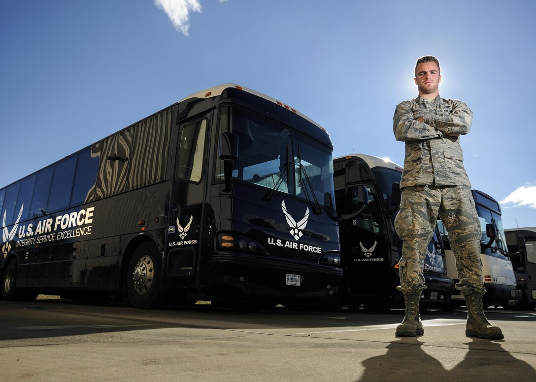 Senior Airman Josiah Parkas, 11th Logistics Readiness Squadron vehicle dispatcher, poses for a photograph near buses that will be used in support of the 58th Presidential Inauguration, at Joint Base Andrews, Md., Jan. 18, 2017.  This will be the first time Parkas has taken part in a presidential inauguration and he stated he is excited to learn ins and outs of the Air Force’s role in the process. (U.S. Air Force photo by Staff Sgt. Stephanie Morris)