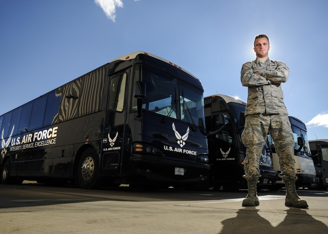 Senior Airman Josiah Parkas, 11th Logistics Readiness Squadron vehicle dispatcher, poses for a photograph near buses that will be used in support of the 58th Presidential Inauguration, at Joint Base Andrews, Md., Jan. 18, 2017.  This will be the first time Parkas has taken part in a presidential inauguration and he stated he is excited to learn ins and outs of the Air Force’s role in the process. (U.S. Air Force photo by Staff Sgt. Stephanie Morris)