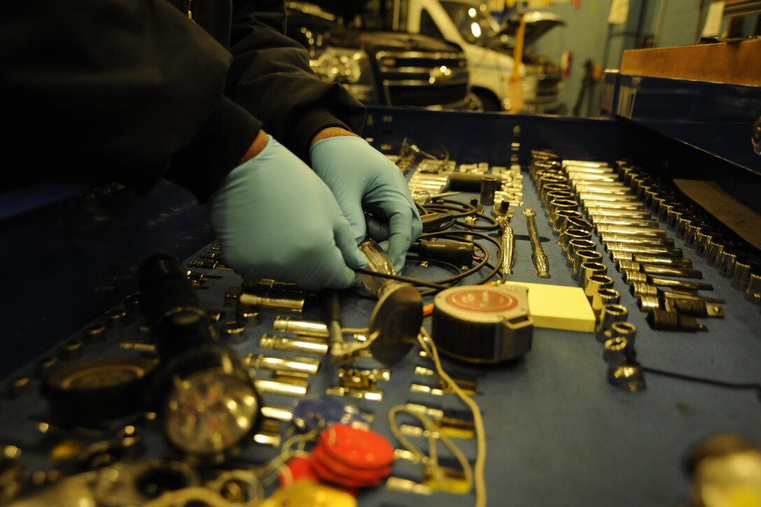 Kevin Owens, 11th Logistics Readiness Squadron automotive technician, selects tools from a tool crib on Joint Base Andrews, Md., Jan. 18, 2017. LRS is currently preparing for the 58th Presidential Inauguration and will be mobilizing approximately 60 Airmen and eight coach buses to transport personnel to and from the event. (U.S. Air Force photo by Staff Sgt. Stephanie Morris)