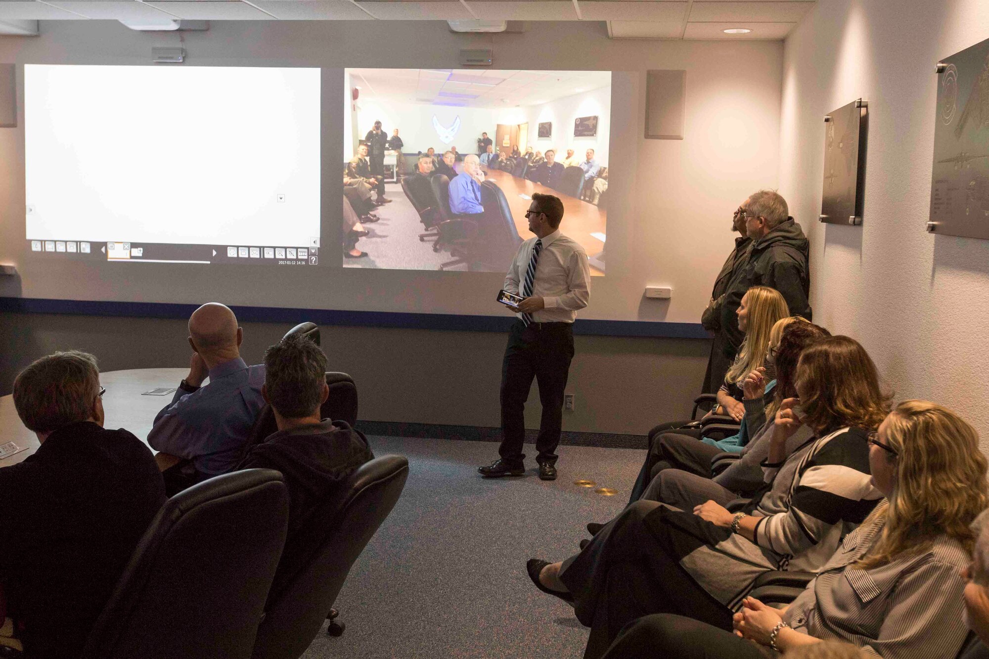 T.J. Wuth, 412th Test Wing Experimental Center for Ideas/Technology Exploration, goes over some features of the renovated Bldg. 2750 conference room Jan. 12. (U.S. Air Force photo by Christian Turner)