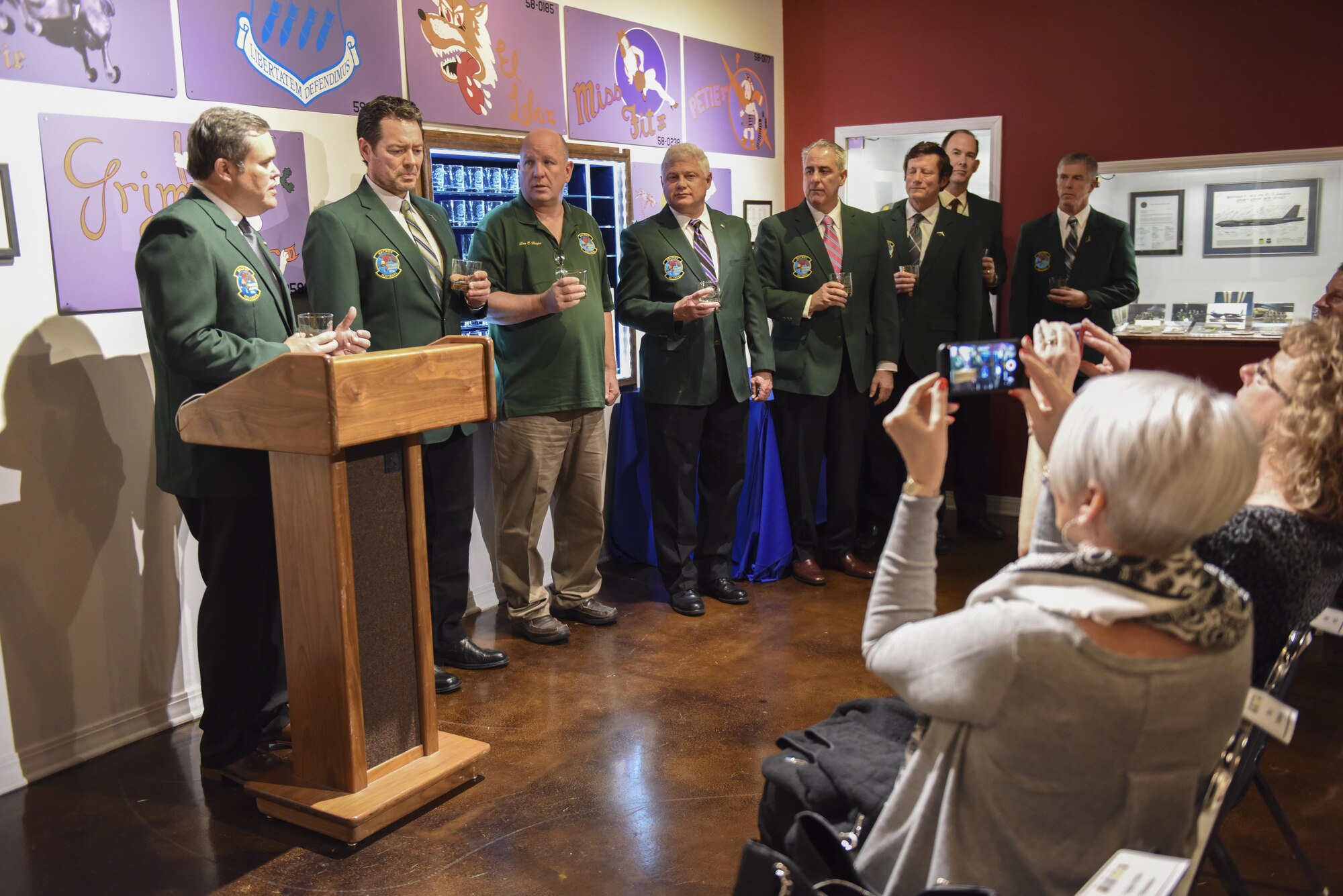Crewmembers from Operation Secret Squirrel give a toast during the 26th anniversary of Operation Secret Squirrel at Barksdale Air Force Base, La., Jan. 17, 2017. The aircraft that supported the operation, Jan. 16, 1991, were the first combat sorties launched for the liberation of Kuwait in support of Operation Desert Storm, and at the time marked the longest combat sortie flight totaling 14,000 miles in 35 hours and 24 minutes. (U.S. Air Force photo/Airman 1st Class Alexis Schultz)
