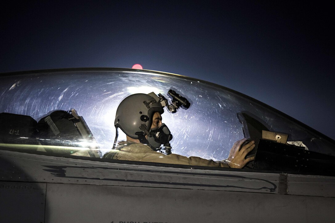 Air Force Capt. David taxis his F-16 Fighting Falcon aircraft before a night mission at Bagram Airfield, Afghanistan, Jan. 13, 2017. David is a pilot assigned to the 79th Expeditionary Fighter Squadron and this is his first assignment as a pilot. Air Force photo by Staff Sgt. Katherine Spessa