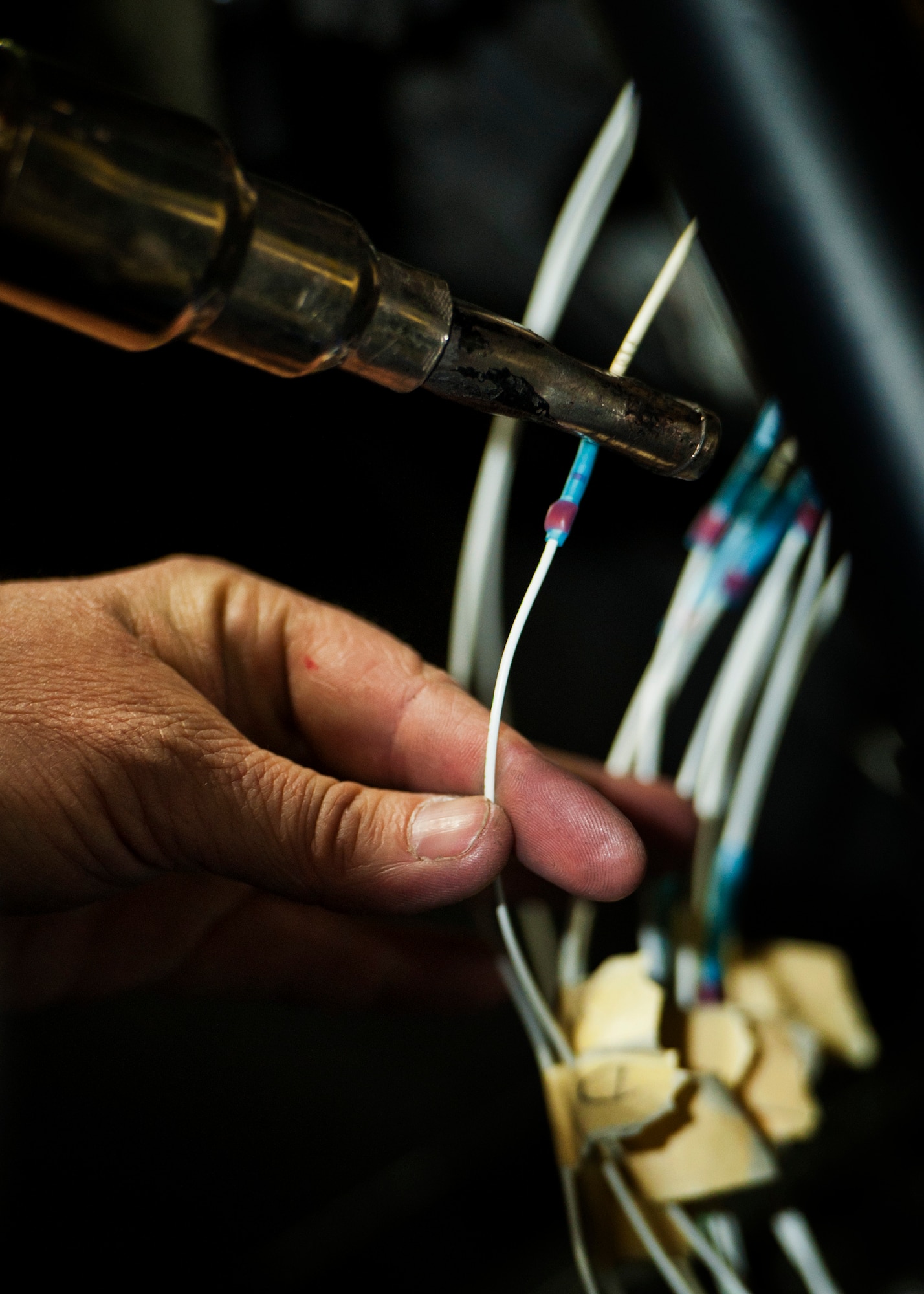 Kim Smith, 54th Helicopter Squadron UH-1N Iroquois mechanic, heats wire joiners at Minot Air Force Base, N.D., Jan. 18, 2017. The ADI, aka gyro horizon, is an instrument that states the orientation of the helicopter to the horizon. (U.S. Air Force photo/Airman 1st Class J.T. Armstrong)