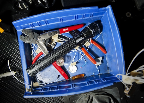 Kim Smith’s, 54th Helicopter Squadron UH-1N Iroquois mechanic, tool box rests inside a UH-1N at Minot Air Force Base, N.D., Jan. 18, 2017.  The tools Smith needed for this job included wire strippers and cutters, electrical tape, a flashlight, a heat gun and wire joiners. (U.S. Air Force photo/Airman 1st Class J.T. Armstrong)