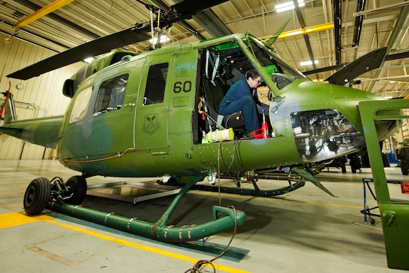 Kim Smith, 54th Helicopter Squadron UH-1N Iroquois mechanic, rewires an attitude director indicator at Minot Air Force Base, N.D., Jan. 18, 2017. The ADI, aka gyro horizon, is an instrument that states the orientation of the helicopter to the horizon. (U.S. Air Force photo/Airman 1st Class J.T. Armstrong)