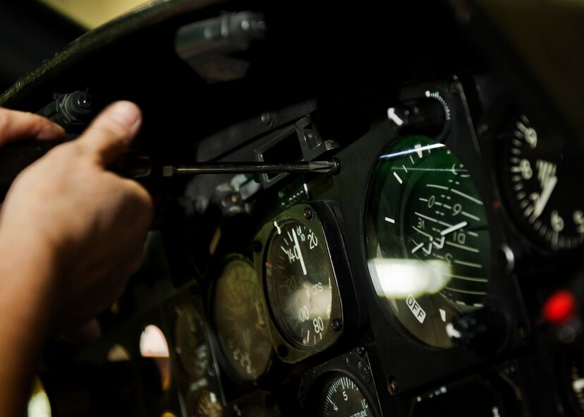 Kim Smith, 54th Helicopter Squadron UH-1N Iroquois mechanic, installs the attitude director indicator into a UH-1N Iroquois at Minot Air Force Base, N.D., Jan. 18, 2017.  The ADI, aka gyro horizon, is an instrument that states the orientation of the helicopter to the horizon. (U.S. Air Force photo/Airman 1st Class J.T. Armstrong)