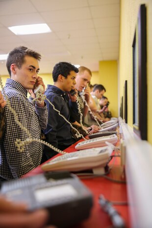 New recruits with Golf Company, 2nd Recruit Training Battalion, make their phone calls home, reading only what is printed on the script in front of them, during receiving at Marine Corps Recruit Depot San Diego, Jan. 17. Recruits will not be able to make another phone call until the end of recruit training. Annually, more than 17,000 males recruited from the Western Recruiting Region are trained at MCRD San Diego. Golf Company is scheduled to graduate April 14.