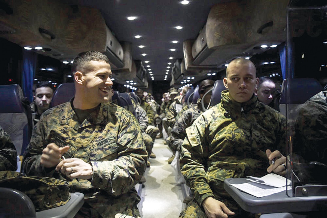 U.S. Marines with Marine Corps Base Quantico wait at the bus prior to the DoD's 58th Presidential Inauguration dress rehearsal in  Washington, D.C., Jan. 15. More than 5,000 military members from across all branches of the armed forces of the United States, including Reserve and National Guard components, provided ceremonial support and Defense Support of Civil Authorities during the inaugural period.