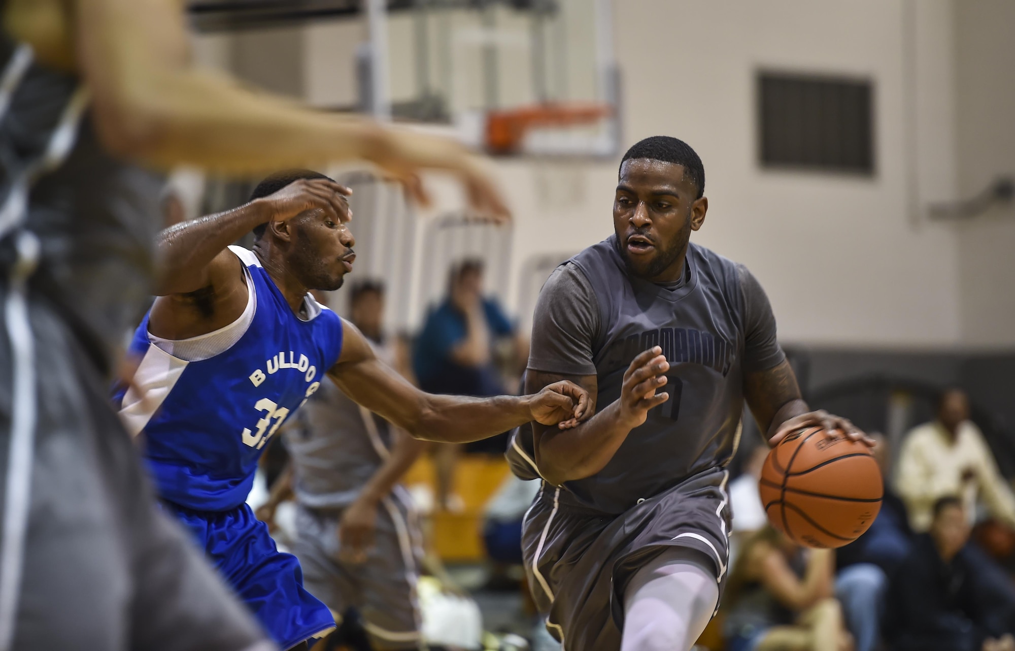 Brian Washington, a member of Hurlburt Field’s basketball team, dribbles a basketball past a defender during a basketball tournament at the Aderholt Fitness Center on Hurlburt Field, Fla., Jan. 15, 2017. Eight Air Force teams from nearby bases competed in the two-day, double-elimination tournament. Hurlburt Field finished second in the championship game against Maxwell Air Force Base in the 2nd annual Martin Luther King Jr. Day tournament. (U.S. Air Force photo by Airman 1st Class Joseph Pick)