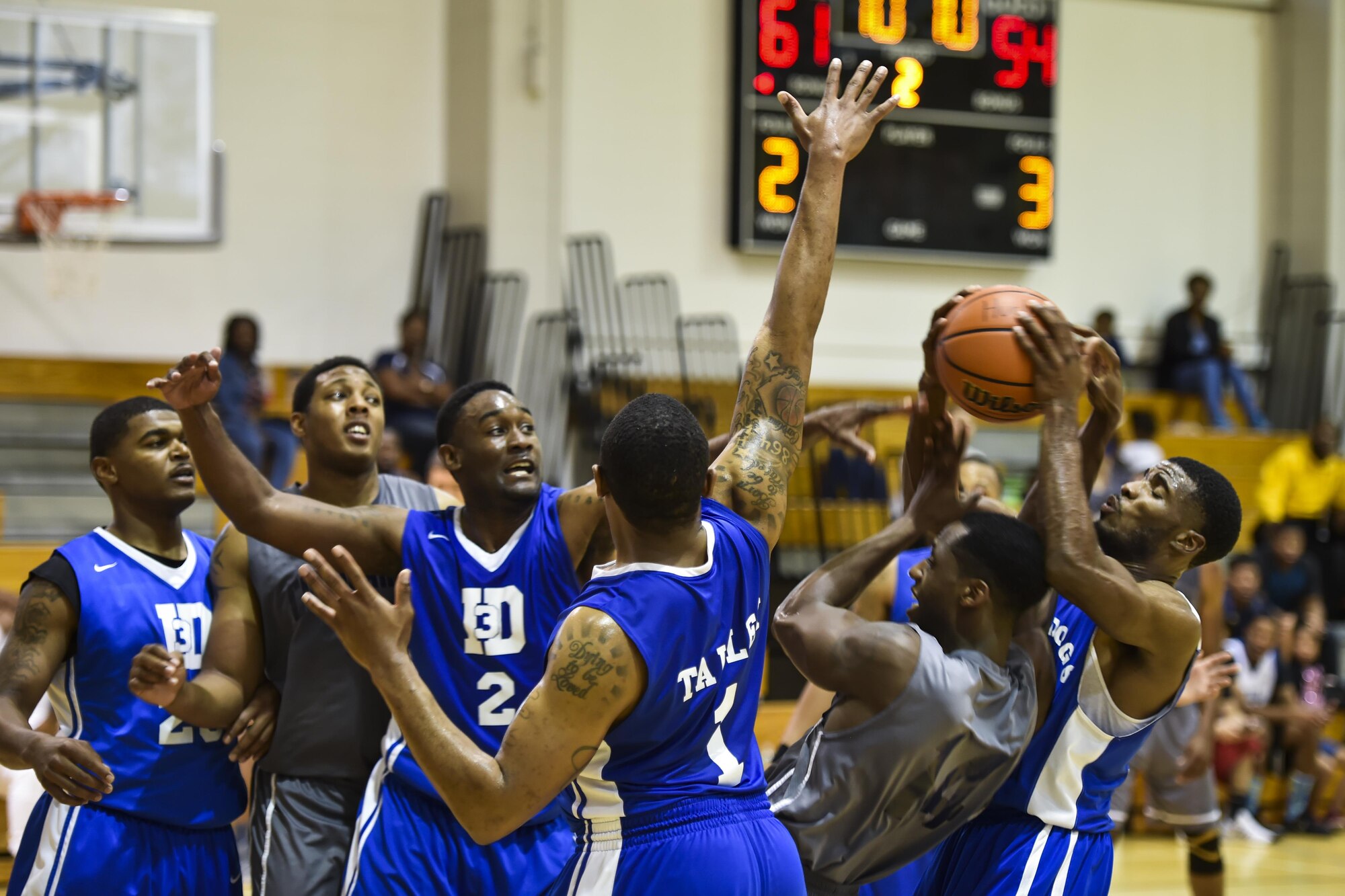 Members of Fort Stewart’s and Hurlburt Field’s basketball teams contest for a basketball during a basketball tournament at the Aderholt Fitness Center on Hurlburt Field, Fla., Jan. 15, 2017. Eight Air Force teams from nearby bases competed in the two-day, double-elimination tournament. Hurlburt Field finished second in the championship game against Maxwell Air Force Base in the 2nd annual Martin Luther King Jr. Day tournament. (U.S. Air Force photo by Airman 1st Class Joseph Pick)
