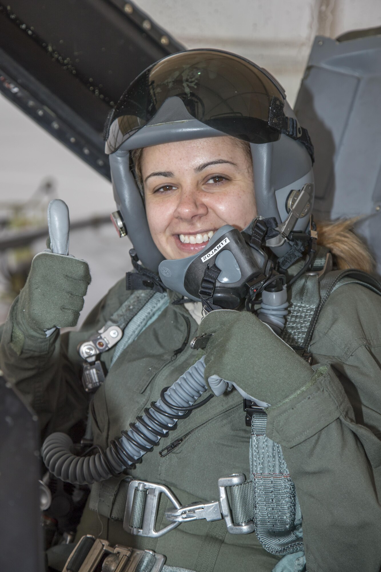 Staff Sgt. Raquel Caramanno, 412th Medical Group, gives a thumbs up before taking off aboard an F-16 Fighting Falcon piloted by Brig. Gen. Carl Schaefer, 412th Test Wing commander. Caramanno was selected as one of the U.S. Air Force's 12 Outstanding Airmen of the Year for 2016. (U.S. Air Force photo by Christian Turner)