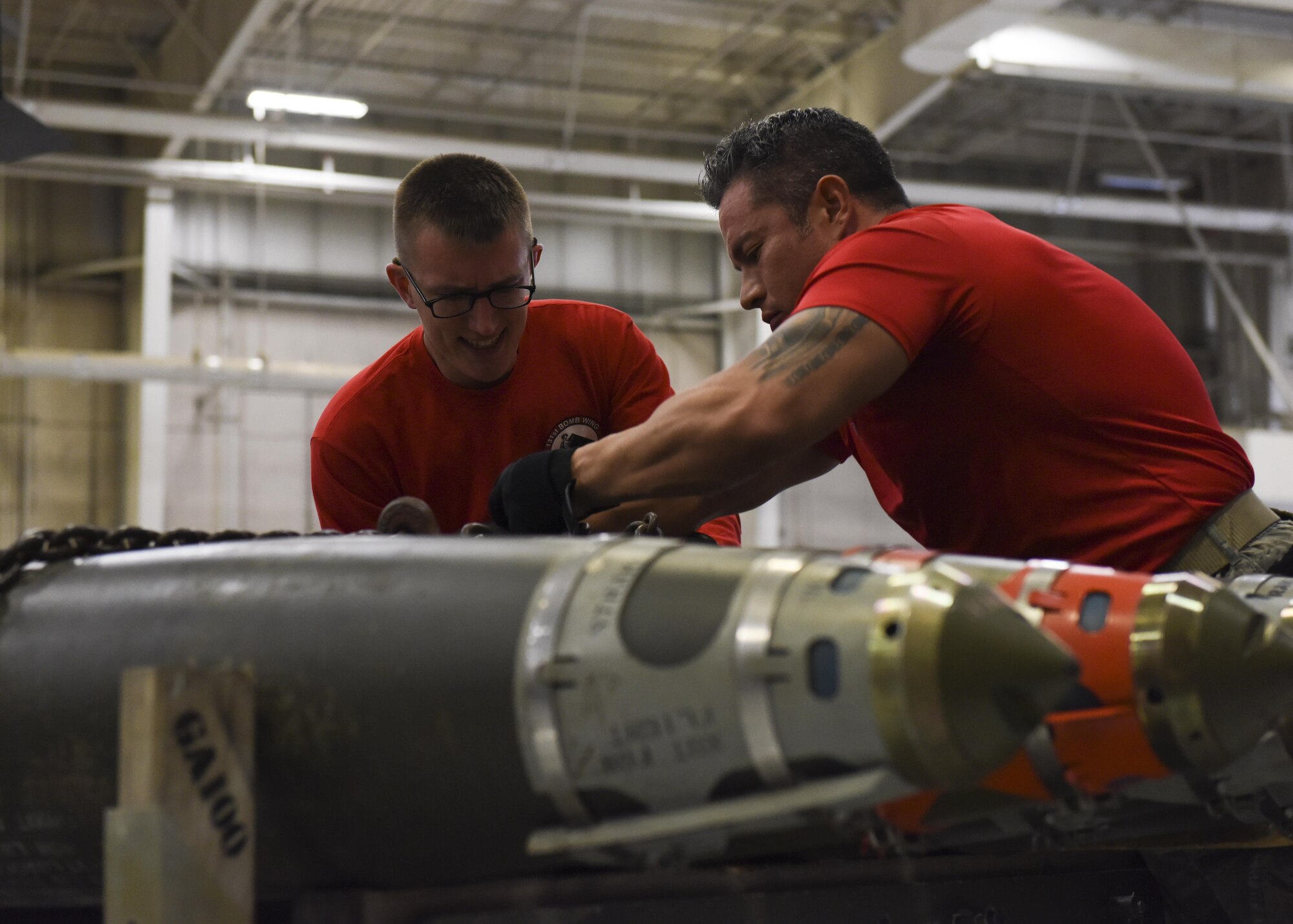 U.S. Air Force Airman 1st Class Zachary Frana, a weapons load crew 4-member assigned to the 393rd Aircraft Maintenance Unit, left, and Tech. Sgt. Ricardo Zuniga, a weapons load crew team chief assigned to the 131st Aircraft Maintenance Squadron, inspect 4 GBU-38s, a 500 lb. class guided weapon, during a fourth quarter load competition at Whiteman Air Force Base, Mo., Jan. 6, 2017. Crews are required to complete the load in 45 minutes or less.