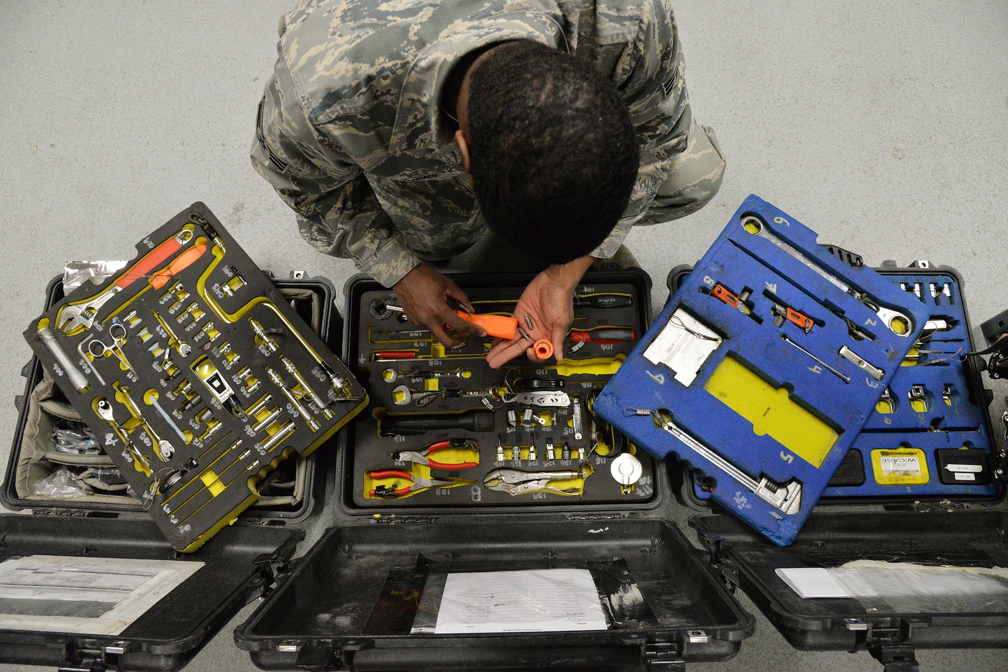 Senior Airman Shaquille Stephens, 341st Missile Maintenance Squadron maintenance technician, looks through kits of tools Jan. 17, 2017, at Malmstrom Air Force Base, Mont. Each day these kits are inspected to ensure maintenance Airmen have the necessary tools to execute their duties in the missile field. (U.S. Air Force photo/Airman 1st Class Daniel Brosam)