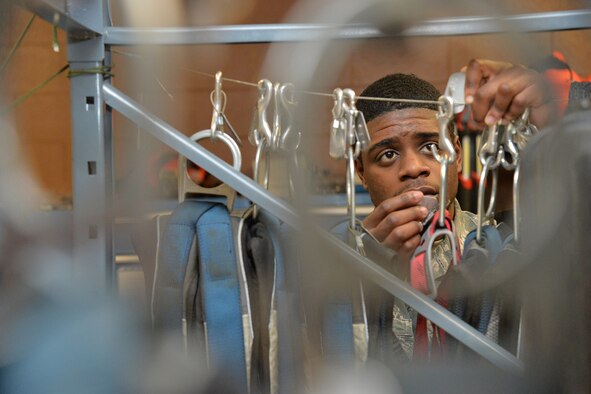 Senior Airman Shaquille Stephens, 341st Missile Maintenance Squadron maintenance technician, checks harnesses Jan. 17, 2017, at Malmstrom Air Force Base, Mont. Harnesses are used in the missile field to protect the wearer as well as give Airmen a way to store the tools by clipping onto the harness. (U.S. Air Force photo/Airman 1st Class Daniel Brosam)