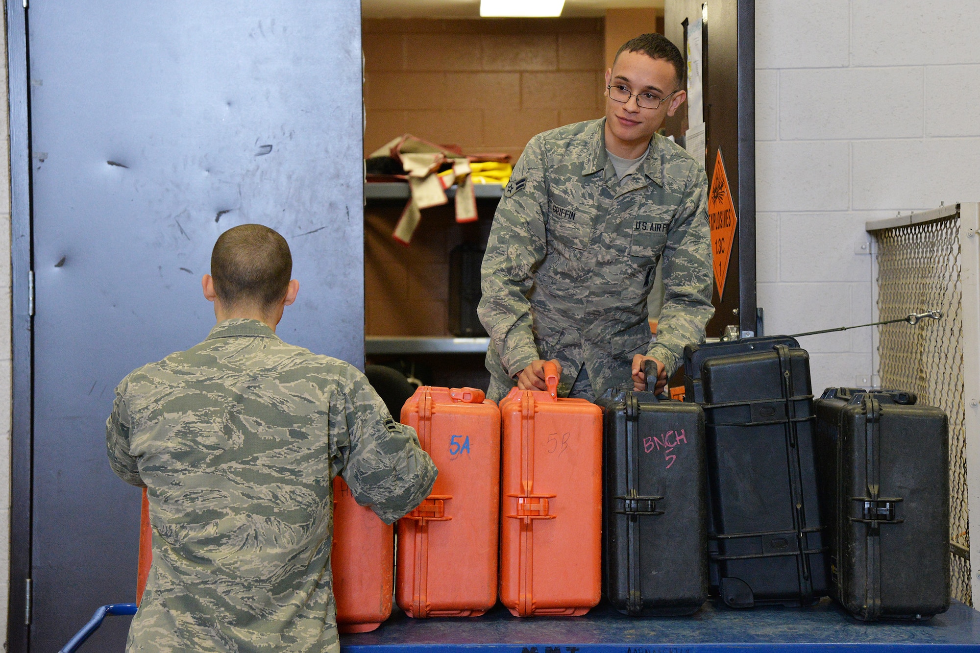 Airmen 1st Class Joseph Griffin, right, and Josiah Remy, 341st Missile Maintenance Squadron maintenance technicians, prepare to load tool kits into a maintenance van Jan. 18, 2017, at Malmstrom Air Force Base, Mont. Tools in each kit range from wrenches, hammers, pry bars and screw drivers to tape, lanyard material, dust caps and bolts. (U.S. Air Force photo/Airman 1st Class Daniel Brosam)