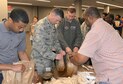Columbus community members, including Col. Doug Gosney, 14th Flying Training Wing Commander, and Col. James Fisher, 14th FTW Vice Commander, pack bag lunches during the Dr. Martin Luther King Jr. Breakfast and Day of Giving event Jan. 16, 2017, in Columbus, Mississippi. Members from Columbus Air Force Base, the City of Columbus, the Columbus-Lowndes Convention and Visitors Bureau, Lowndes County Board of Supervisors, Mississippi University for Women, Sodexo Food Services, and the United Way of Lowndes County all participated in the event to show their support. (U.S. Air Force photo by 2nd Lt. Savannah Stephens)