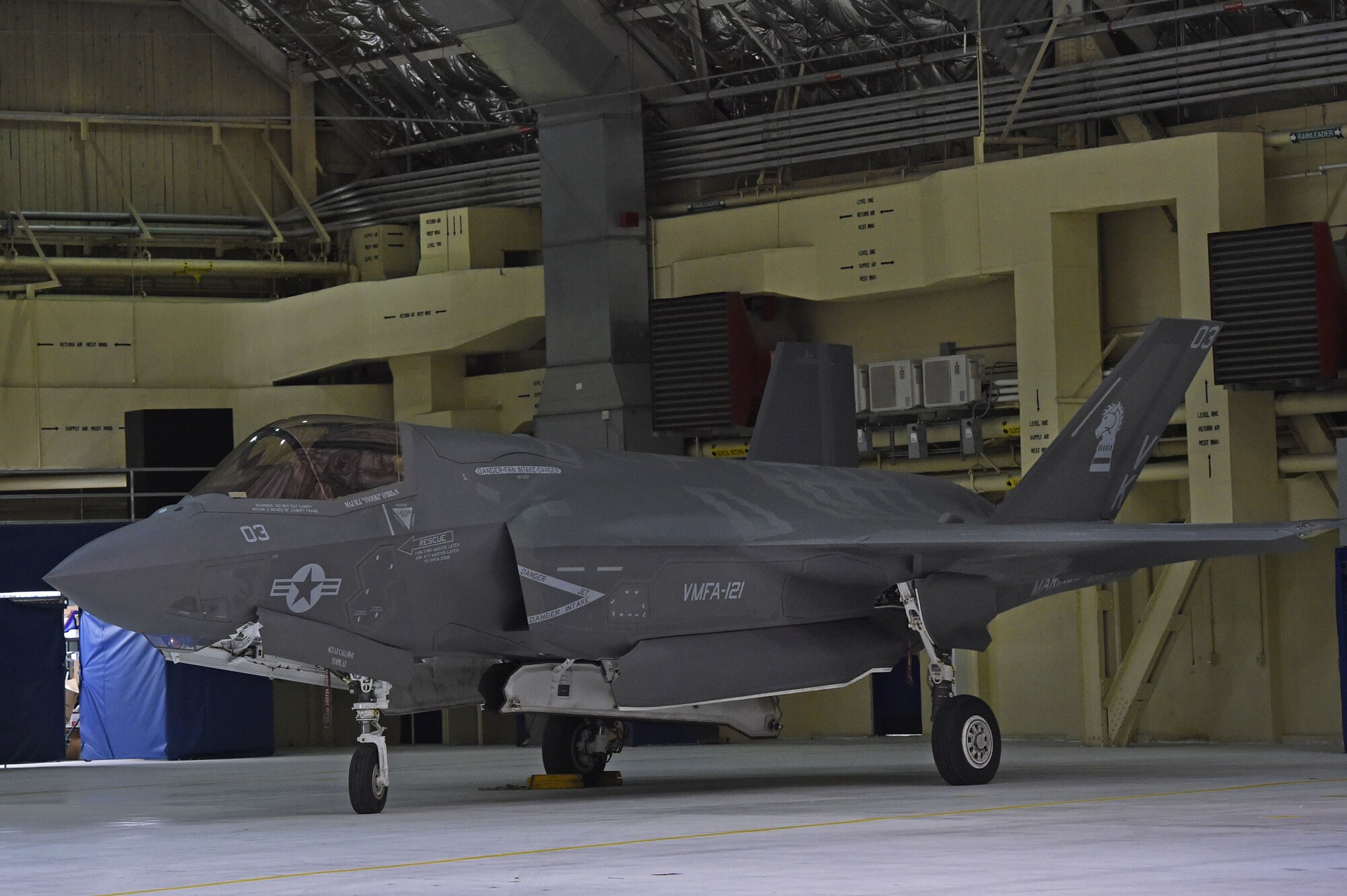 Marines assigned to Marine Fighter Attack Squadron (VMFA) 121, 3rd Marine Aircraft Wing, move F-35Bs in a hangar, Jan. 13, 2017, during a stop on Joint Base Elmendorf-Richardson, Alaska, en route to Marine Corps Air Station Iwakuni, Japan. VMFA-121 is the first operational F-35B squadron in the Marine Corps, with its relocation to 1st Marine Aircraft Wing at Iwakuni. The F-35B was developed to replace the Marine Corps’ F/A-18 Hornet, AV-8B Harrier and EA- 6B Prowler. The Short Take-off Vertical Landing (STOVL) aircraft is a true force multiplier. The unique combination of stealth, cutting-edge radar and sensor technology, and electronic warfare systems bring all of the access and lethality capabilities of a fifth-generation fighter, a modern bomber, and an adverse-weather, all-threat environment air support platform.