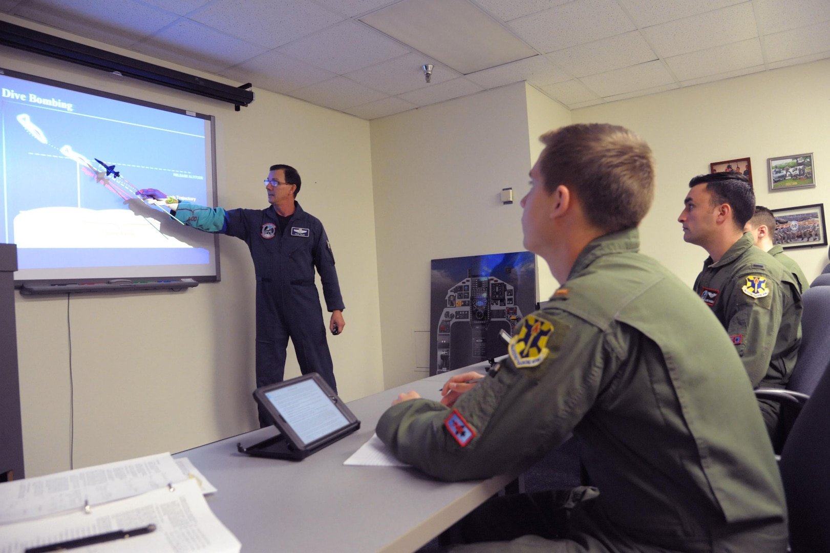 Paul Olde, 12th Operations Support Squadron simulator and academics instructor, teaches a surface attack class at Joint Base San Antonio-Randolph, Jan. 19, 2017.  The 12th OSS is responsible for pilot instructor training and introduction to fighter fundamentals academic and simulator training, scheduling, air traffic control, airfield management, flight records, registrar, weather, airspace management, international training and aircrew flight equipment for all 12th Operations Group training.