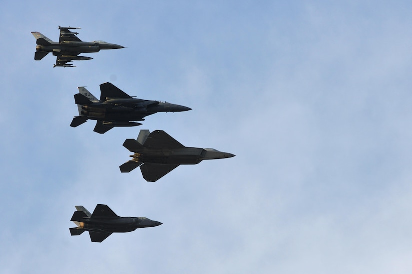 Four U.S. Air Force fighter jets practice the inauguration flyover at Joint Base Langley-Eustis, Va., Jan. 19, 2017. The formation is comprised of two, fourth generation fighters (F-15 and F-16) along with two, fifth generation fighters (F-22 and F-35). (U.S. Air Force photo by Airman 1st Class Tristan Biese)