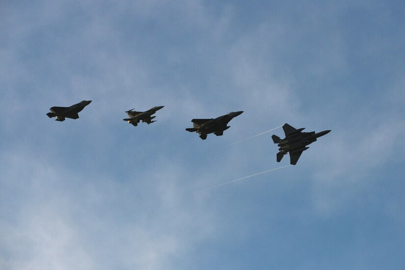 Four U.S. Air Force fighter jets practice for the inauguration flyover at Joint Base Langley-Eustis, Va., Jan. 19, 2017. The formation is comprised of two, fourth generation fighters (F-15 and F-16) along with two, fifth generation fighters (F-22 and F-35). (U.S. Air Force photo by Airman 1st Class Tristan Biese)