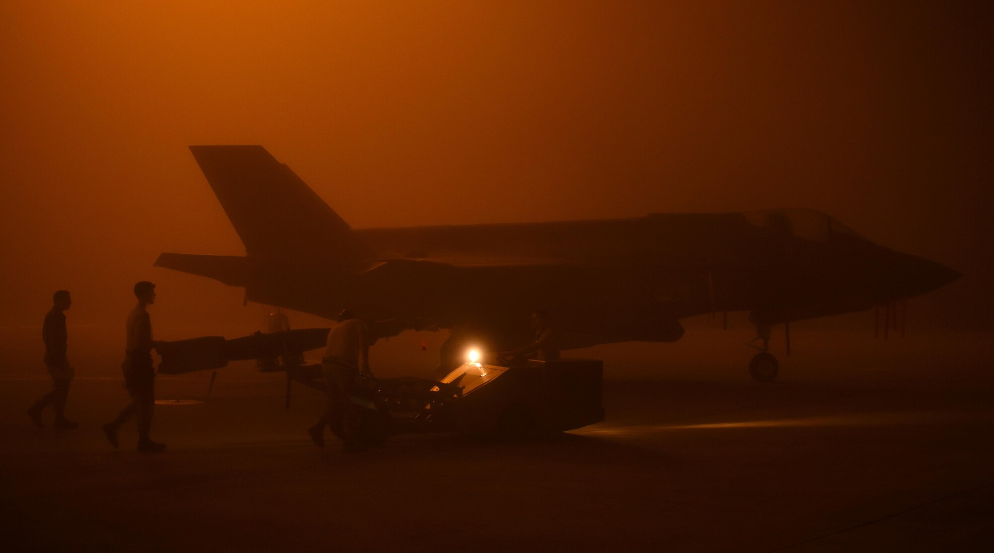 A U.S. Air Force weapons load crew assigned to the 33rd Aircraft Maintenance Squadron transports a live GBU-12 to an F-35A January 18, 2017, at Eglin Air Force Base, Florida. The 33rd Fighter Wing loaded and released the Air Education and Training Command’s first live bombs from an F-35A. Six aircraft were loaded with armed GBU-12s, and two bombs were released over the Eglin Air Force Base range. (U.S. Air Force photo by Staff Sgt. Peter Thompson)