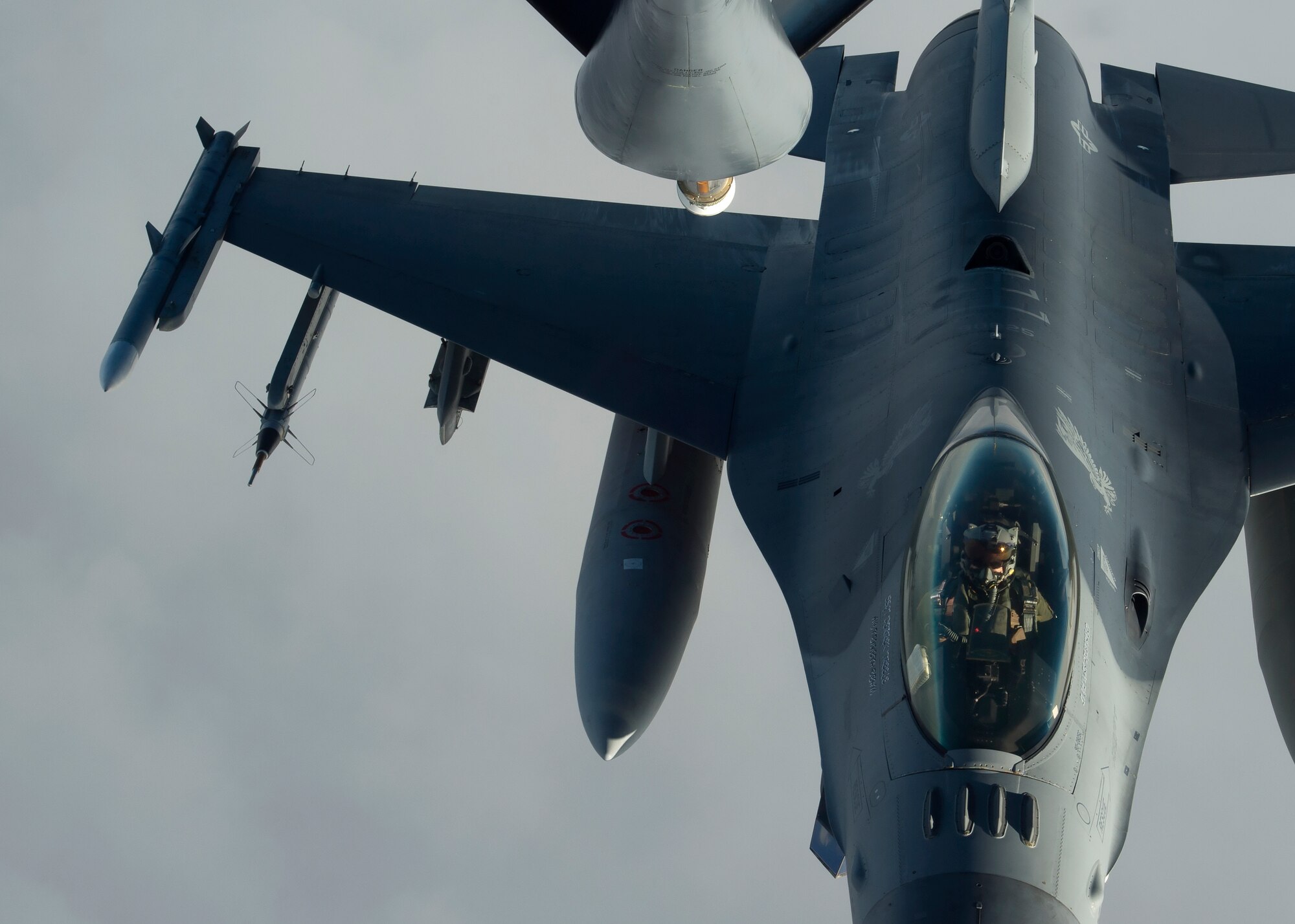 U.S. Air Force F-16 Fighting Falcon pilots with the 13th and 14th Fighter Squadrons conduct air-to-air refueling with a KC-135 Stratotanker assigned to the 134th Air Refueling Wing, Tennessee Air National Guard, over Northern Japan, Jan. 18, 2017. Pilots must maintain tanker qualification every six months to stay proficient and capable. Midair refueling also extends a pilots warfare capabilities by almost two hours, potentially saving more lives during combat. (U.S. Air Force photo by Senior Airman Deana Heitzman)