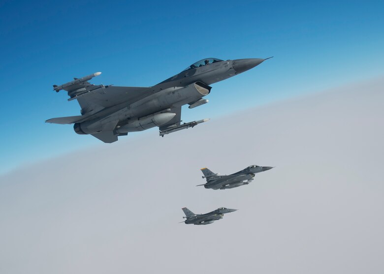 U.S. Air Force pilots with the 13th and 14th Fighter Squadrons fly alongside a KC-135 Stratotanker, assigned to the 134th Air Refueling Wing, Tennessee Air National Guard, over Northern Japan, Jan. 18, 2017. Pilots must maintain tanker qualification every six months to stay proficient and capable for training and combat scenarios. If pilots are not proficient in tanking, it could cause them to land in obscure or enemy territory. (U.S. Air Force photo by Senior Airman Deana Heitzman)