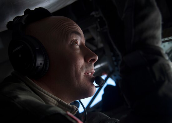 U.S. Air Force Master Sgt. Eric Jones, boom operator assigned to the 134th Air Refueling Wing, Tennessee Air National Guard, refuels 13th and 14th Fighter Squadron F-16 Fighting Falcons over Northern Japan, Jan. 18, 2017. Boom operators refuel various types of aircraft in midair, extending the amount of time spent on training or combat missions. (U.S. Air Force photo by Senior Airman Deana Heitzman)