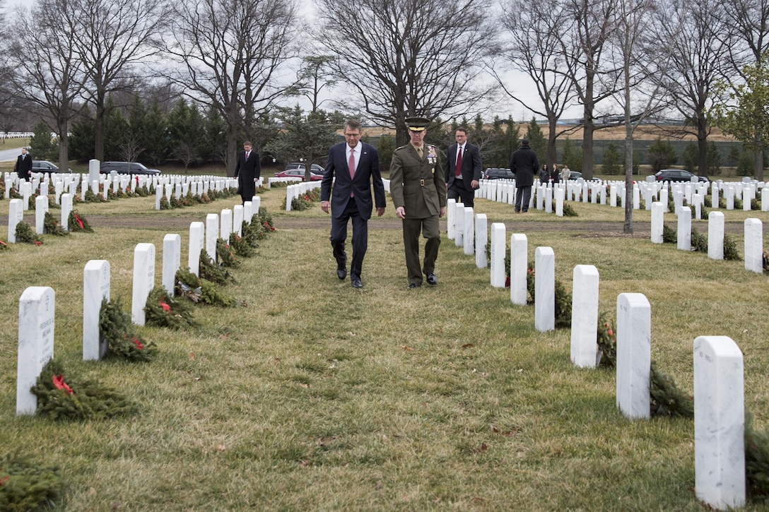 Defense Secretary Ash Carter and Marine Corps Brig. Gen. Eric Smith visit Arlington National Cemetery in Arlington, Va., Jan. 19, 2017, on Carter's last day in office. DOD photo by Air Force Tech. Sgt. Brigitte N. Brantley