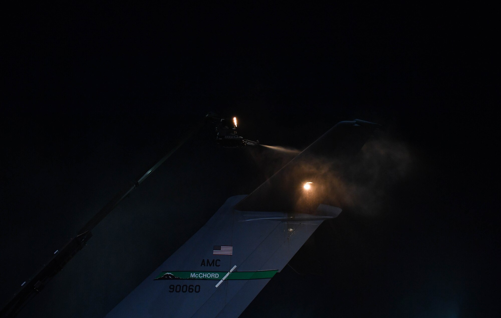 U.S. Air Force Reserve Senior Airman José Agadier, 452nd Aircraft Maintenance Squadron C-17 Globemaster III crew chief, sprays propylene glycol onto the tail of a C-17 aircraft at Ramstein Air Base, Germany, Jan. 19, 2017. The spray is used to deice aircraft approximately 20 minutes before they depart. Airmen from multiple Reserve aircraft maintenance squadrons are on a temporary duty assignment at Ramstein to train with the 721st AMXS. (U.S. Air Force photo by Senior Airman Tryphena Mayhugh)