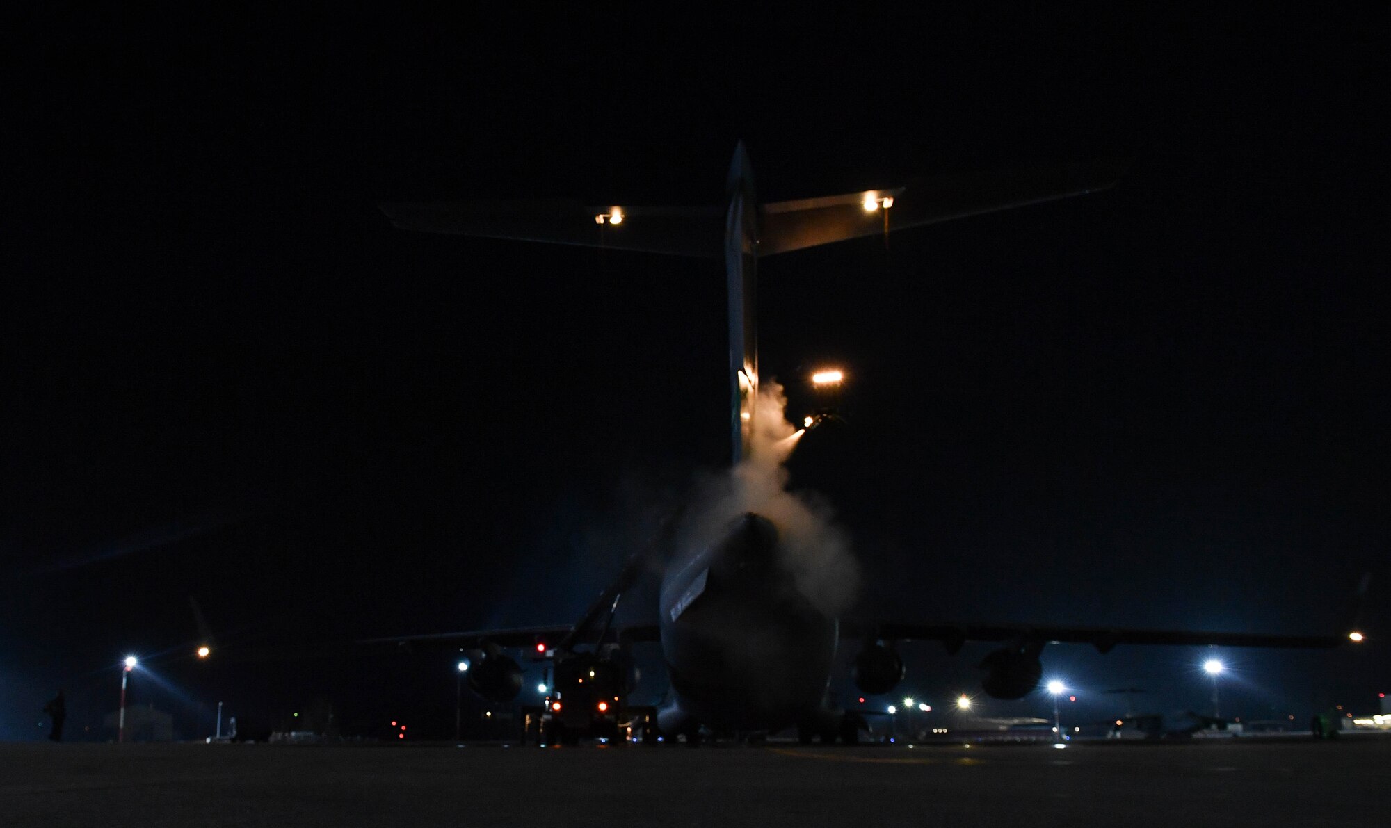 U.S. Air Force Reserve Airmen assigned to the 452nd Aircraft Maintenance Squadron and 446th Maintenance Squadron spray propylene glycol onto a C-17 Globemaster III aircraft at Ramstein Air Base, Germany, Jan. 19, 2017. The purpose of the spray is to deice the tail and wings of aircraft that are about to depart. Airmen from multiple Reserve aircraft maintenance squadrons are on a temporary duty assignment at Ramstein to train with the 721st AMXS. (U.S. Air Force photo by Senior Airman Tryphena Mayhugh)