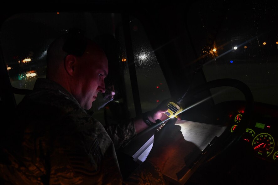 U.S. Air Force Reserve Tech. Sgt. Paul Stibbe, 446th Maintenance Squadron C-17 Globemaster III crew chief, logs the time he and other Airmen completed spraying propylene glycol onto a C-17 at Ramstein Air Base, Germany, Jan. 19, 2017. Airmen from multiple Reserve aircraft maintenance squadrons are on a temporary duty assignment at Ramstein to train with the 721st AMXS. (U.S. Air Force photo by Senior Airman Tryphena Mayhugh)