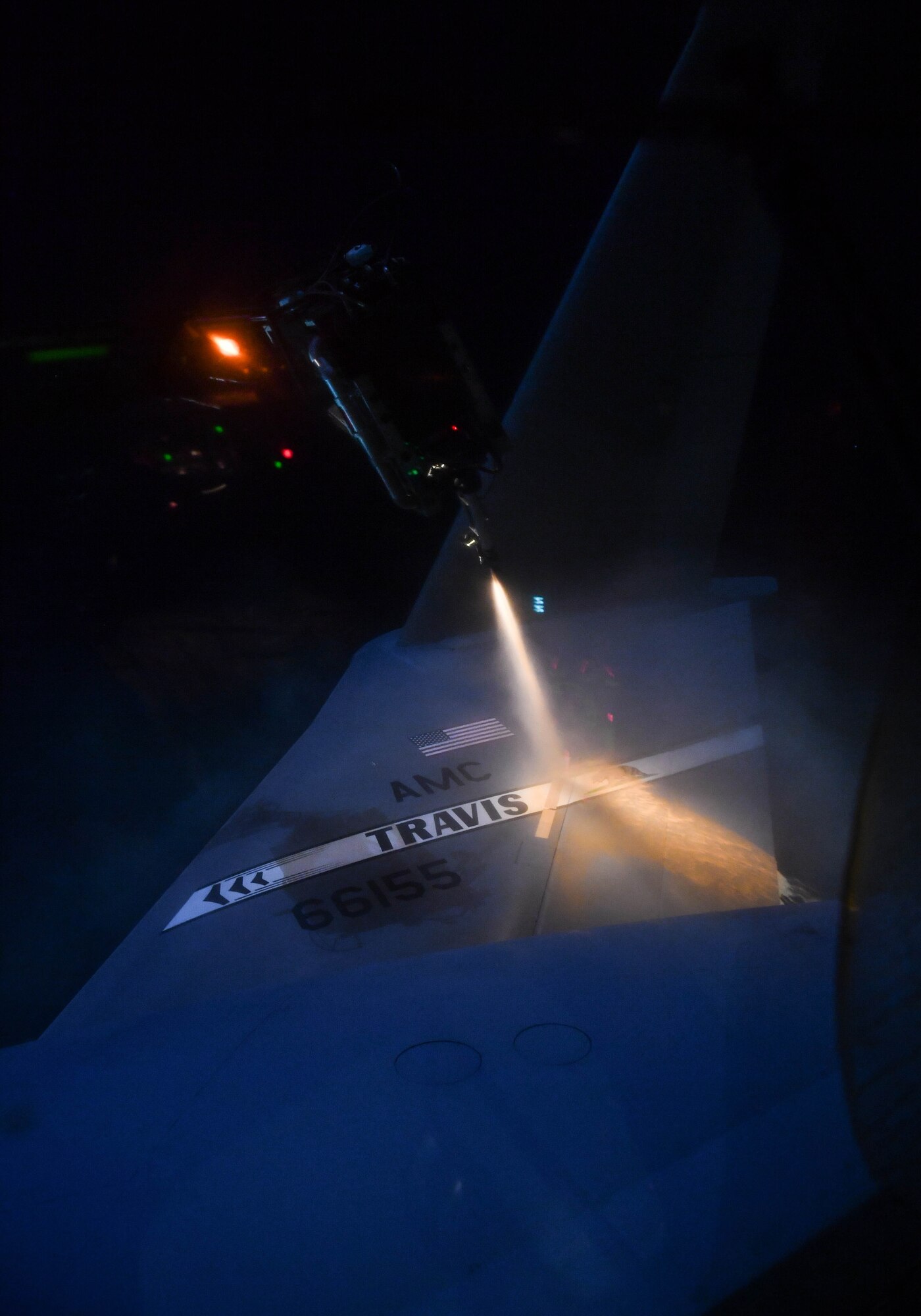 Propylene glycol, a liquid used to deice aircraft, slides down the tail of a C-17 Globemaster III aircraft at Ramstein Air Base, Germany, Jan. 19, 2017. The liquid absorbs water, which removes ice from the aircraft. Airmen from multiple U.S. Air Force Reserve aircraft maintenance squadrons are on a temporary duty assignment at Ramstein to train with the 721st AMXS. As a part of this training, many of the Airmen deice aircraft when it is required. (U.S. Air Force photo by Senior Airman Tryphena Mayhugh)