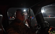 U.S. Air Force Reserve Tech. Sgt. Paul Stibbe, 446th Maintenance Squadron C-17 Globemaster III crew chief, uses a radio to communicate with another Airman while they deice a C-17 aircraft at Ramstein Air Base, Germany, Jan. 19, 2017. Stibbe and his partner sprayed propylene glycol to deice the aircraft before it departed. Airmen from multiple Reserve aircraft maintenance squadrons are on a temporary duty assignment at Ramstein to train with the 721st AMXS. (U.S. Air Force photo by Senior Airman Tryphena Mayhugh)